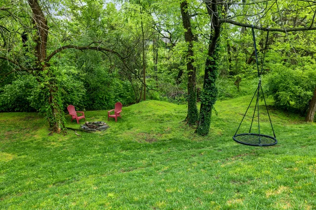 a backyard of a house with trampoline