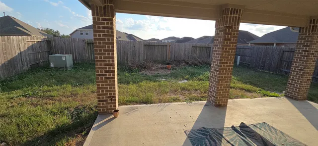 a view of a backyard with pathway