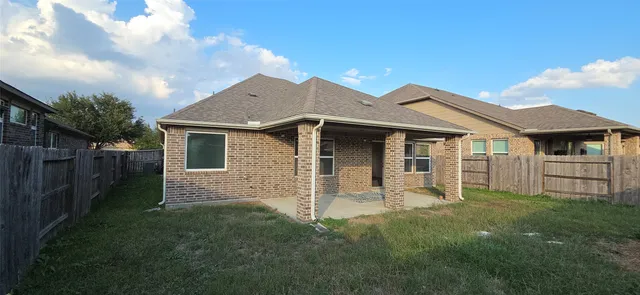 a front view of a house with yard