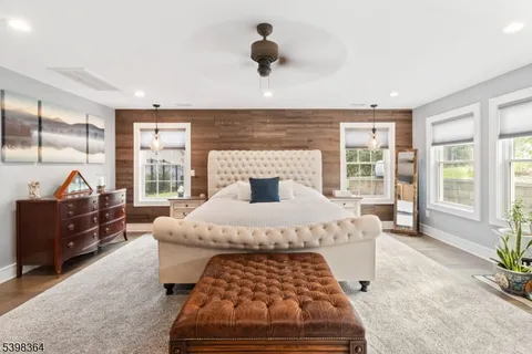 a bedroom with a large bed and a window