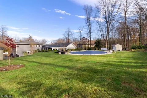 a view of a patio with table and chairs and potted plants
