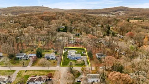 an aerial view of residential house with outdoor space