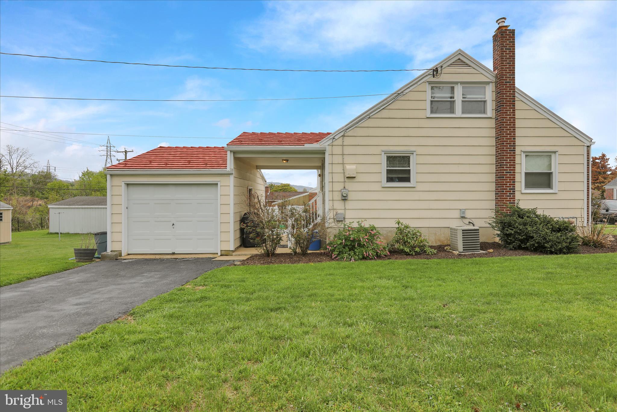 3357 Sheidy Avenue Reading, PA 19605 - Photo 5 of 31 a front view of a house with a yard and garage