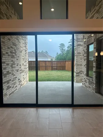 a view of a living room and floor to ceiling window
