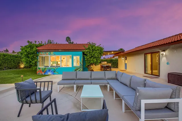 a patio with patio a couch and chairs