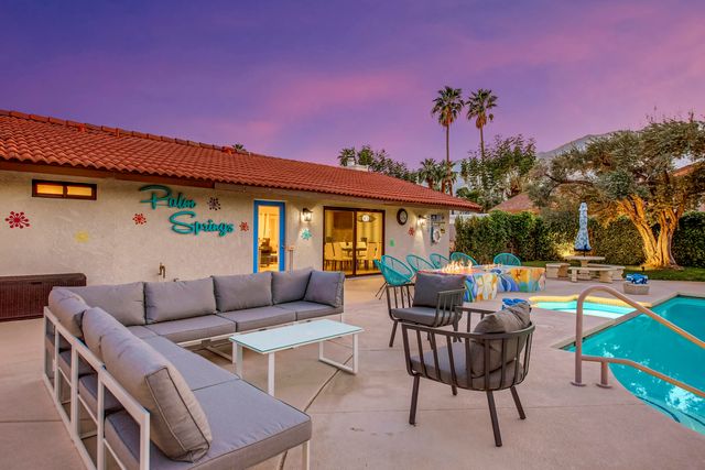 a view of a table and chairs in the patio