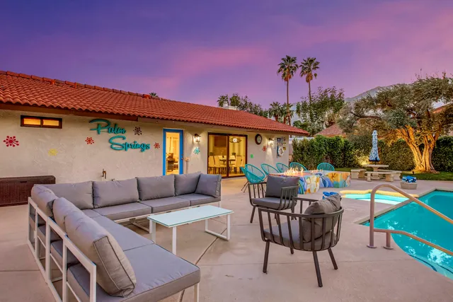 a view of a table and chairs in the patio