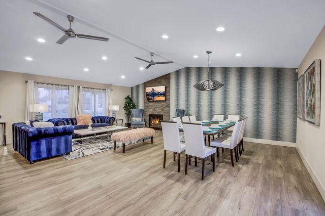 a kitchen with a refrigerator sink and cabinets