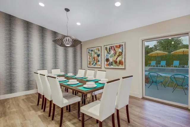 a bedroom with a large bed and a large window