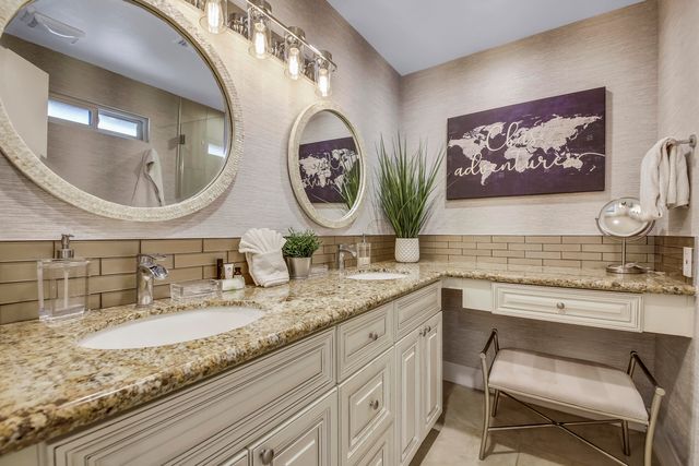 a view of a patio with couches table and chairs under an umbrella with a barbeque