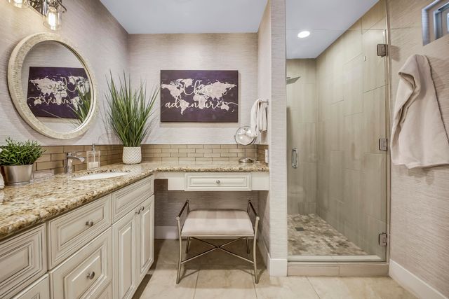 a view of a patio with a table and chairs and potted plants