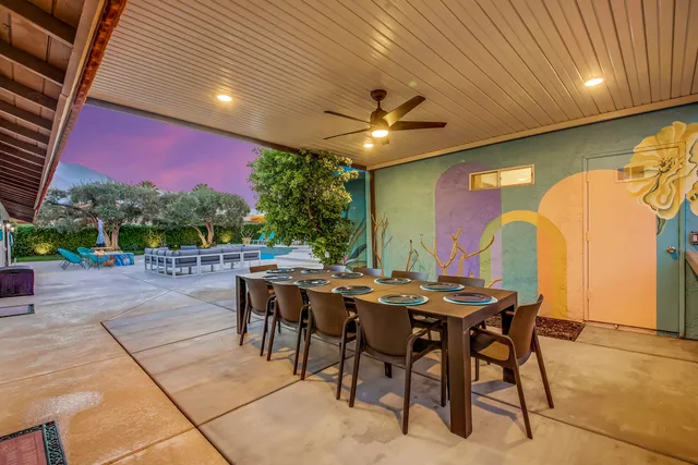 a view of a dinning table and chairs in the patio