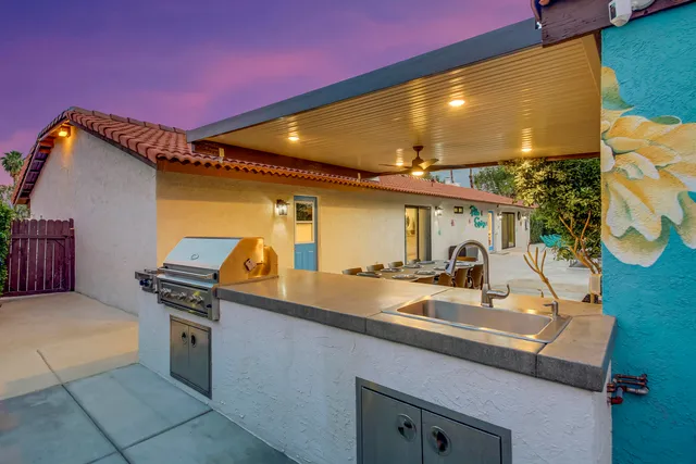 a kitchen with stainless steel appliances granite countertop a sink and cabinets