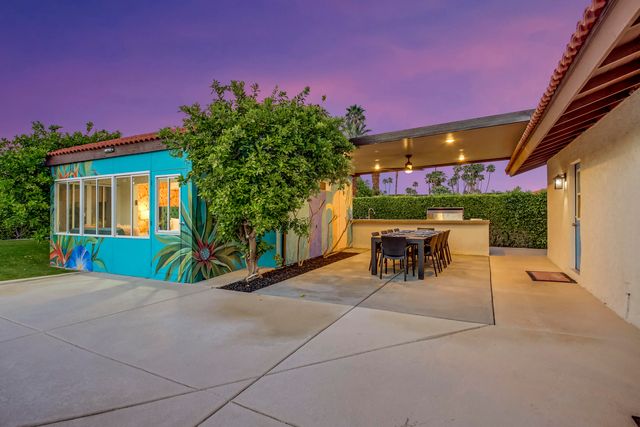 a view of a chairs and table in the patio