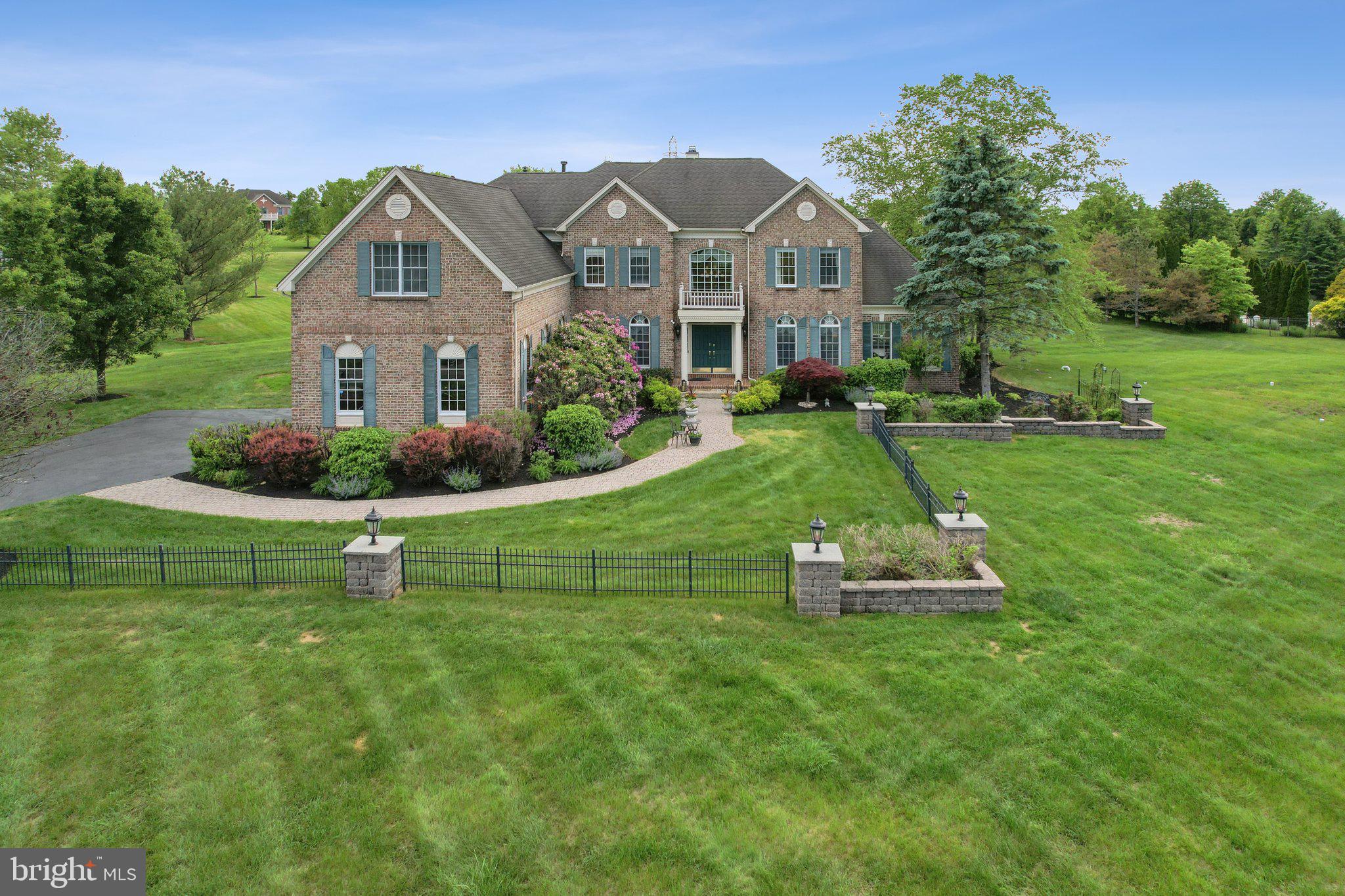 1 Baker Way Pennington, NJ 08534 - Photo 58 of 77 a front view of a house with a yard