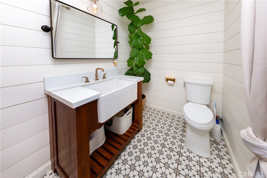 85 Saddlebow Road Bell Canyon, CA 91307 - Photo 27 of 75 a bathroom with a sink a toilet and a mirror