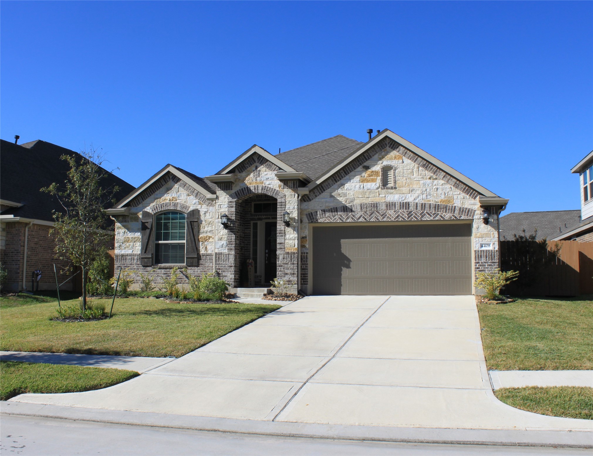4408 Mimic Drive Spring, TX 77386 - Photo 27 of 27 a front view of a house with a yard and garage