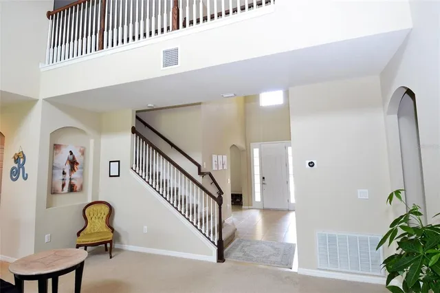 a view of a livingroom with furniture and entryway
