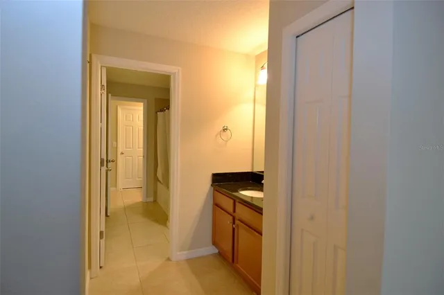 a view of a bathroom from a hallway