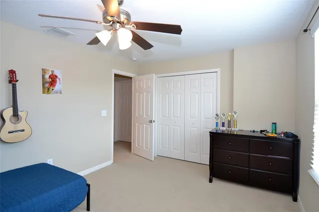 a room that has a dresser and a window