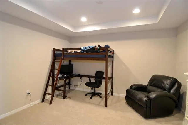 a view of livingroom with furniture and a chair