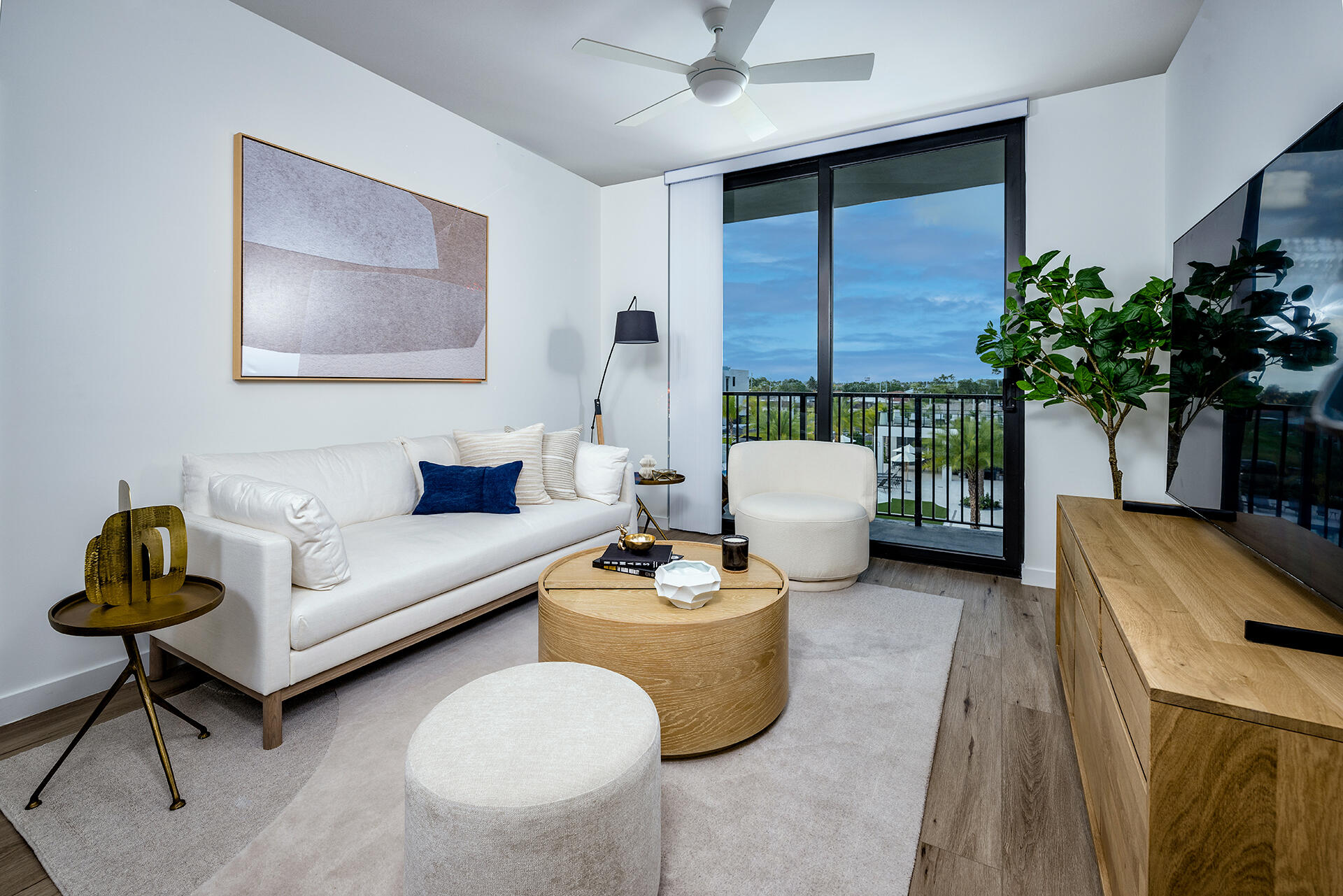 2000 Stirling Road, Unit 8102 Hollywood, FL 33020 - Photo 6 of 19 a living room with furniture and a potted plant