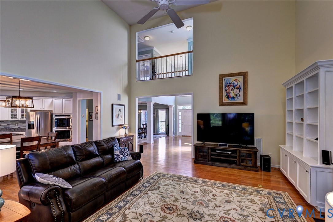 9405 Ashlock Court Toano, VA 23168 - Photo 11 of 43 a living room with furniture and a flat screen tv
