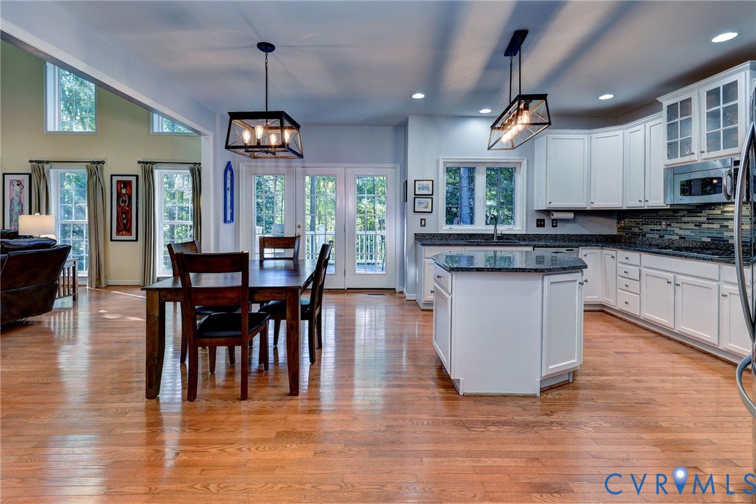 9405 Ashlock Court Toano, VA 23168 - Photo 12 of 43 a view of a dining room with furniture window and wooden floor