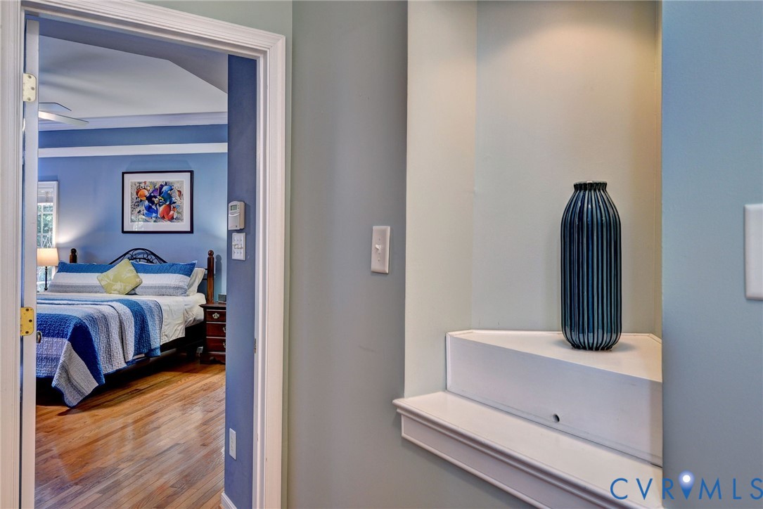 9405 Ashlock Court Toano, VA 23168 - Photo 17 of 43 a bedroom with a bed and wooden floor