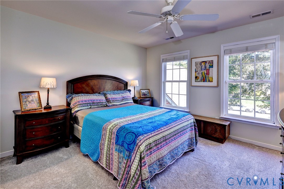 9405 Ashlock Court Toano, VA 23168 - Photo 28 of 43 a bedroom with a bed and a window