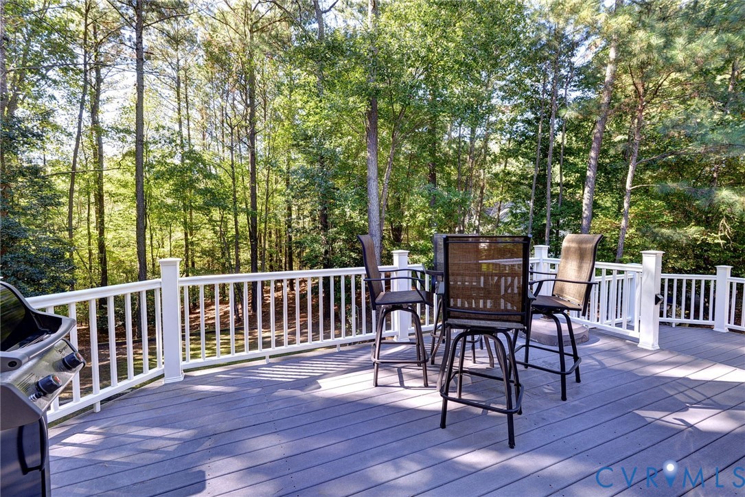 9405 Ashlock Court Toano, VA 23168 - Photo 34 of 43 a view of a deck with furniture and trees around