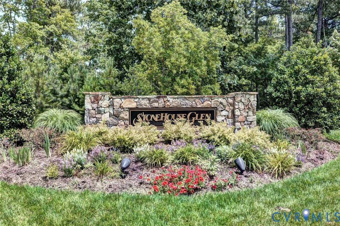 9405 Ashlock Court Toano, VA 23168 - Photo 40 of 43 a view of a sign in a garden
