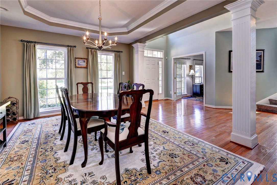 9405 Ashlock Court Toano, VA 23168 - Photo 6 of 43 a view of a dining room with furniture window and wooden floor