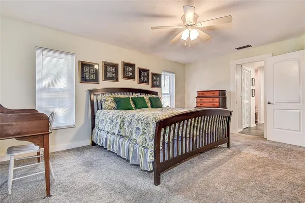 a bed room with a bed and a television