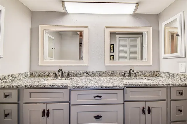 a bed room with a bed and a television