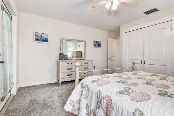 a view of a livingroom with furniture and a large window