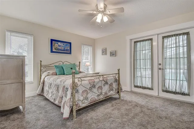 a bathroom with a granite countertop sink a toilet and a mirror