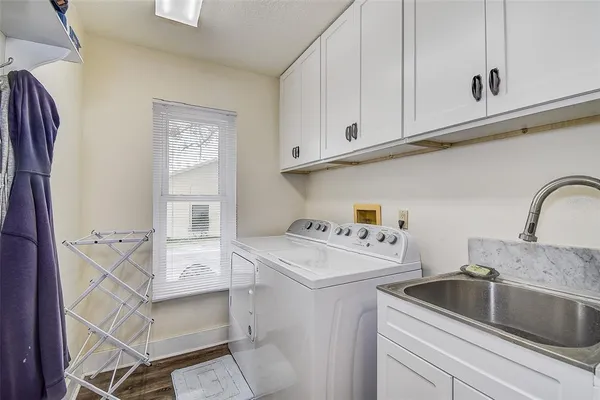 a view of a backyard with wooden fence
