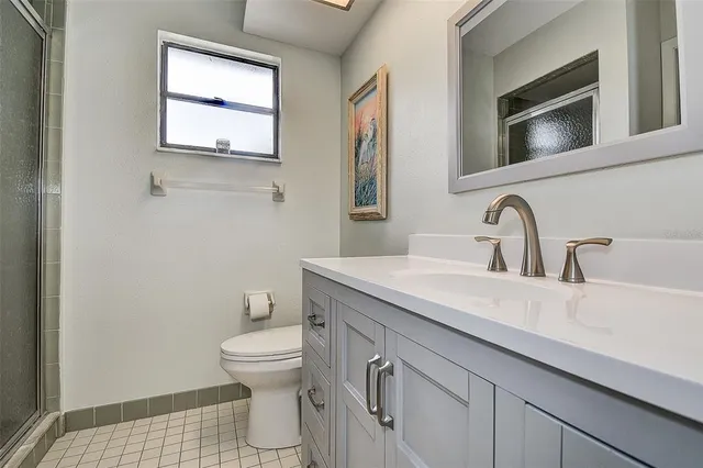 an aerial view of multiple houses with yard