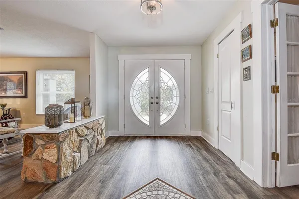 a kitchen with a refrigerator and a sink