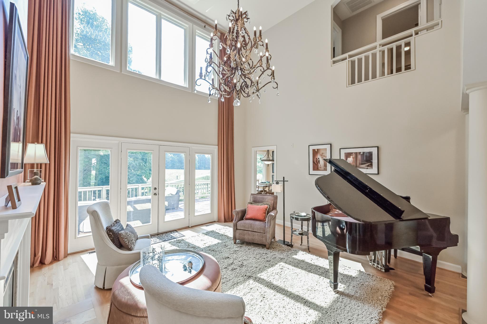 11311 Bright Pond Lane Reston, VA 20194 - Photo 5 of 50 Two Story Formal Living Room with Wall of Windows