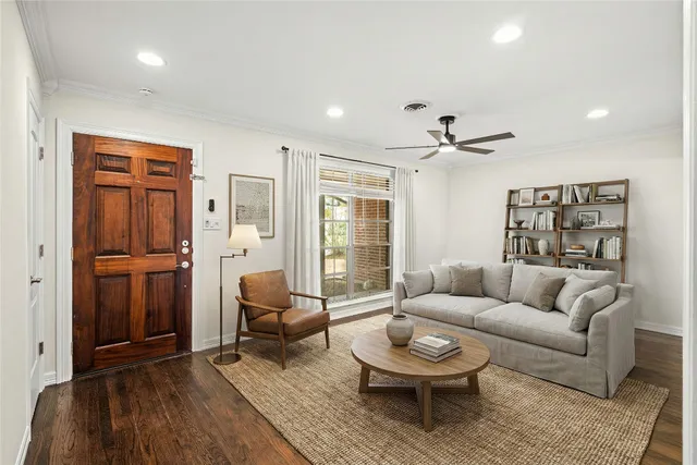 a living room with furniture and a rug