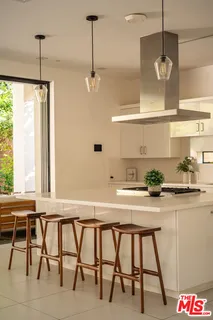 a kitchen with a table and chairs in it