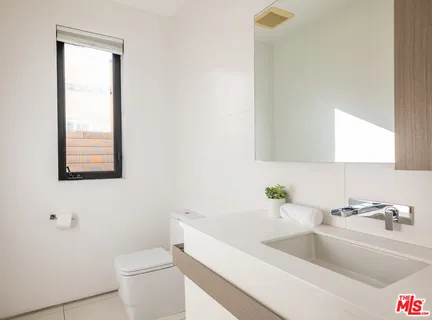 a view of a house with balcony and garden