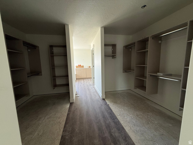 1008 West 3410 South Nibley, UT 84321 - Photo 11 of 26 Walk-in closet featuring light wood-finish shelving and hanging rods