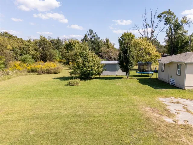 a house view with swimming pool and mountains in the background