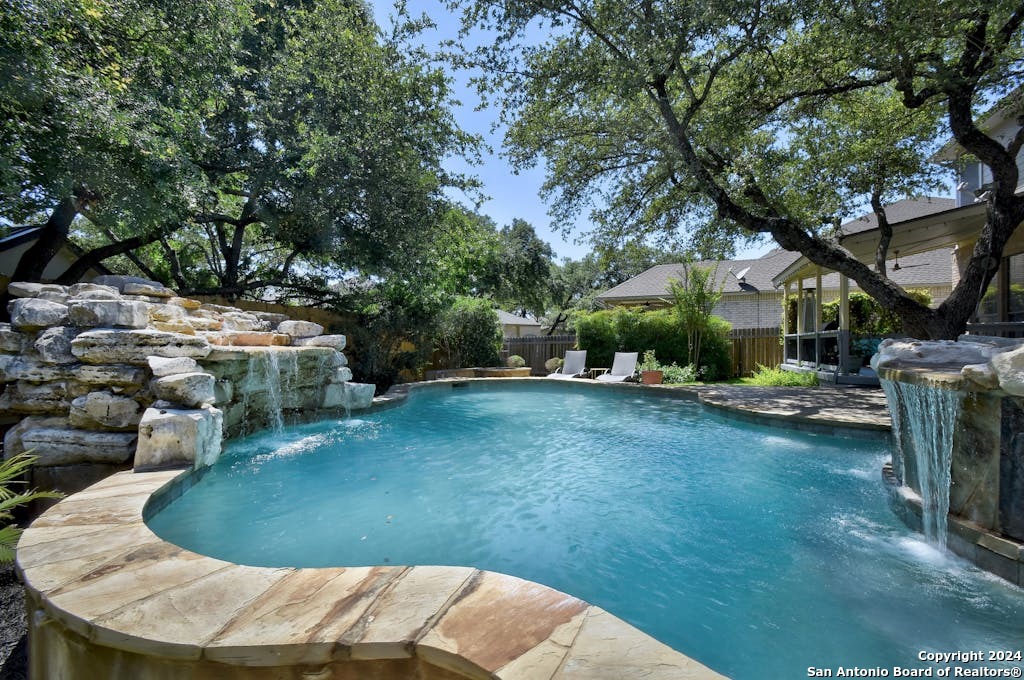 a view of a swimming pool with a patio