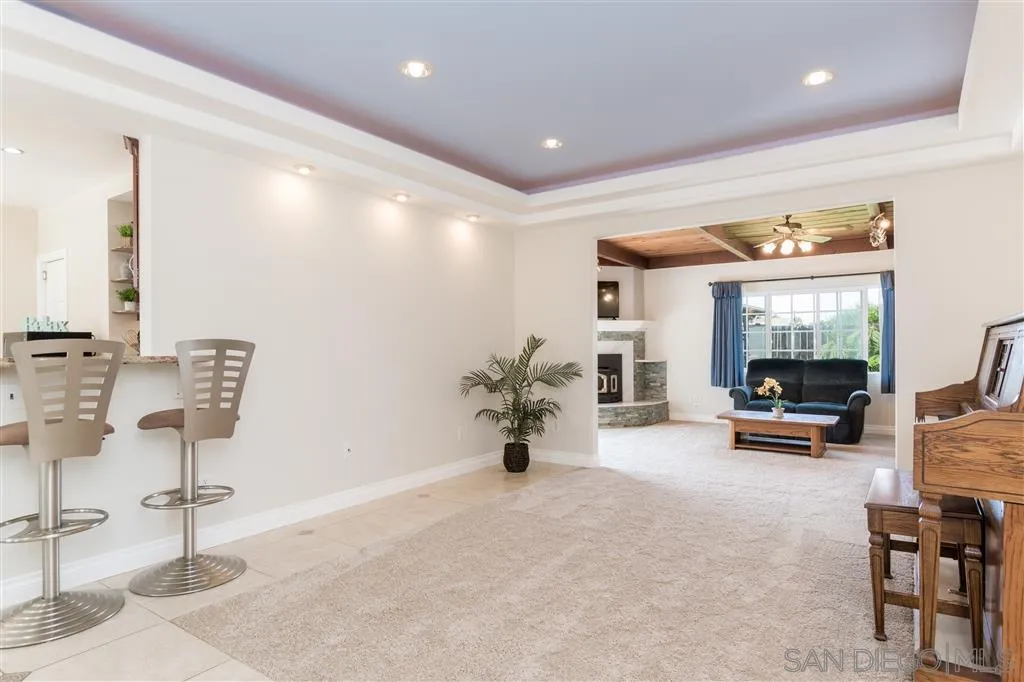 5168 Constitution Road San Diego, CA 92117 - Photo 3 of 25 a view of a livingroom with furniture and a flat screen tv