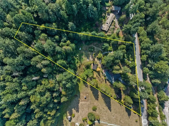 a view of a street with trees