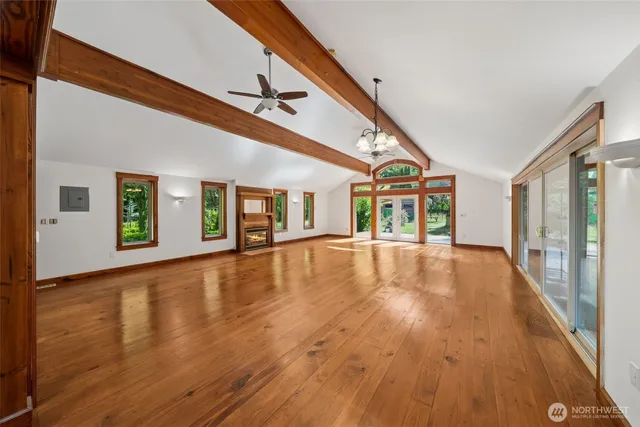 a view of an entryway with wooden floor
